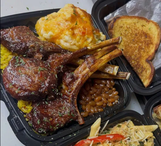 Glazed lamb chops over yellow rice with baked beans, mac and cheese and Texas toast